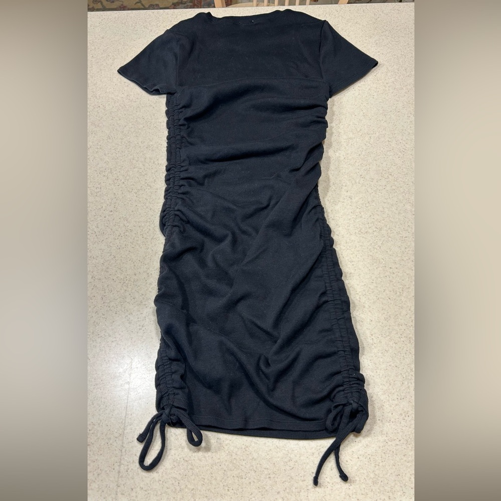 Garage knit dress size MEDIUM. Short sleeve, ruched on the sides. Black